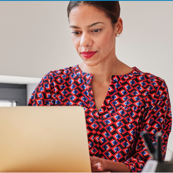 young female professional seated at laptop