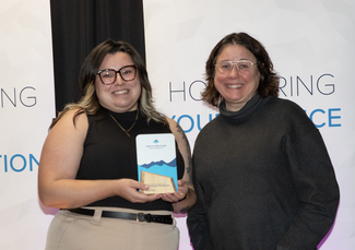 Maddy Thomas receives the award for Emerging Leader from VIU President Deb Saucier